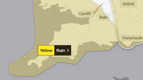 A map showing Devon and Cornwall with a yellow rain warning covering the region.