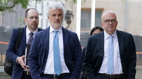 Getty Images Former White House chief of staff under President Joe Biden, Jeffrey Zients (2nd L), arrives at Leonard L. Williams Justice Center on July 16, 2025 in Wilmington, Delaware