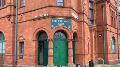 External view of Salford Lads Club red brick building.