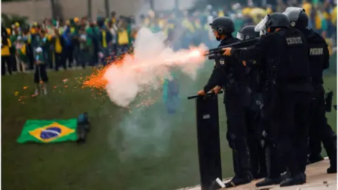 Reuters Security forces operate as supporters of Brazil's former President Jair Bolsonaro demonstrate against President Luiz Inacio Lula da Silva, outside Brazil's National Congress in Brasilia