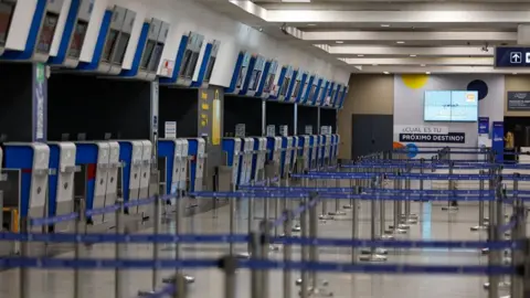 EPA Empty check-in area in Buenos Aires' airport. Photo: 9 May 2024