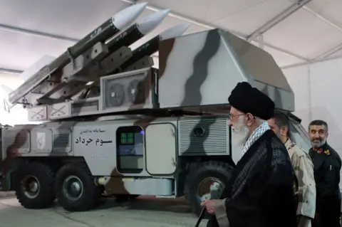 AFP File photo showing Iranian Supreme Leader Ayatollah Ali Khamenei is shown a Khordad-3 air defence system (11 May 2014)