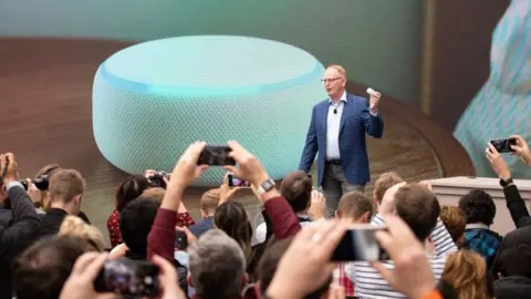 Getty Images Dave Limp with Echo Dot