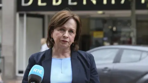 Pacemaker Diane Dodds speaking to media outside Debenhams