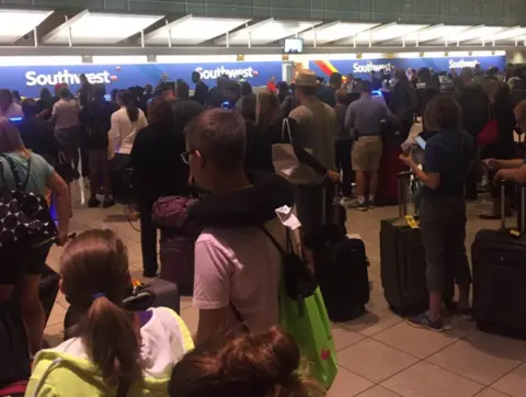 Twitter @PoorRobin Queue at Southwest check-in