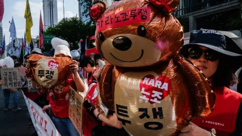 Getty Images Members of the Korean Confederation of Trade Unions take part in a Labour Day rally in Seoul, South Korea.