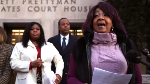 Getty Images Georgia election workers Ruby Freeman and her daughter Shaye Moss speak outside of the E. Barrett Prettyman U.S. District Courthouse on December 15, 2023 in Washington, DC.