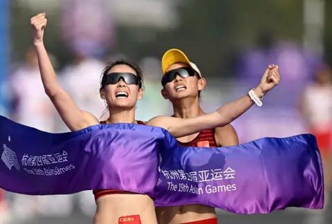 Dylan Martinez / Reuters China's Yang Jiayu crosses the line to win the gold medal in the women's 20km race walk final