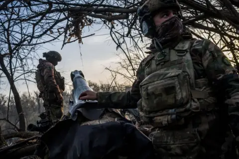 Getty Images File image of Ukrainian troops preparing artillery cannons