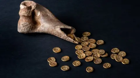 Norfolk Museums Service The Sedgeford Hoard, 32 gold Iron-Age coins found inside a cow bone at Sedgeford, Norfolk,