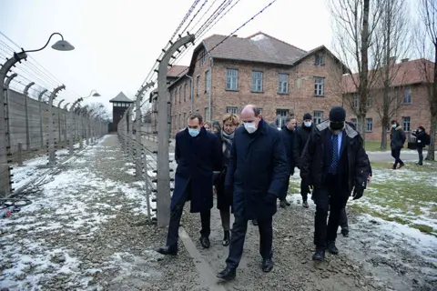 Bartosz Siedlik / AFP French Prime Minister Jean Castex visits the Memorial and Museum Auschwitz-Birkenau of the former German Nazi concentration and extermination camp in Oswiecim on 27 January 2022