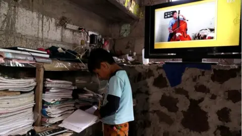 Reuters Oscar Hernandez, 5, follows a televised class at home as millions of students returned to classes virtually after schools were ordered into lockdown in March, due to the coronavirus disease (COVID-19) outbreak, in Chilcuautla, Hildalgo state, Mexico August 24, 2020.