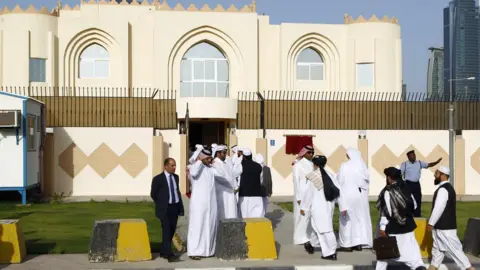 Getty Images Guests arrive for the opening ceremony of the new Taliban political office in Doha on June 18, 2013