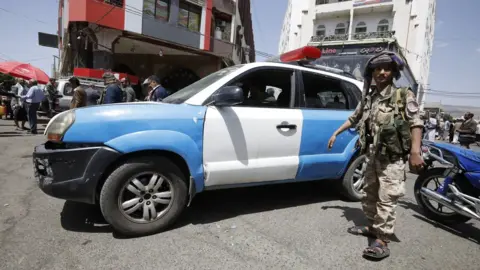 EPA Houthi forces stand guard during a rally in Sanaa, Yemen (6 June 2021)