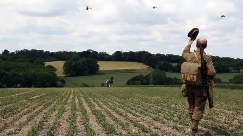 Geoff Caddick/Woodland Trust A man wearing a World War One soldier's uniform at Langley Vale
