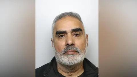 West Yorkshire Police A police mugshot of Jagtar Sahota - a middle-aged man with short hair and a grey beard.