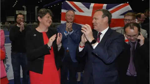 Pacemaker Arlene Foster and Nigel Dodds celebrate election success at the Titanic Belfast count centre.