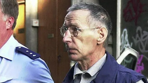 AFP Michel Fourniret arriving at the courthouse in Liege on 26 June 2003