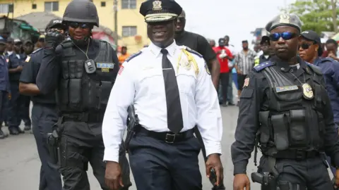 EPA Liberia's police chief Col Patrick Sudue keeping an eye on a demonstration in the capital, Monrovia, Liberia - Monday 12 November 2018