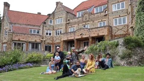 Lucy Merrilyn Todd Sharpville and his band jam in a garden as they isolate together with their families and pets