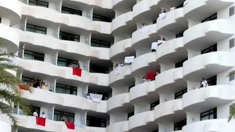 Reuters Students visiting from the mainland to celebrate the end of term are isolated in a hotel in Majorca after testing positive for coronavirus disease last week