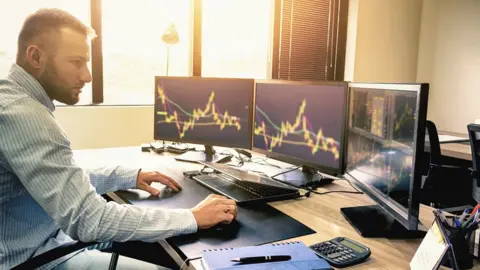 Getty Images man trading shares