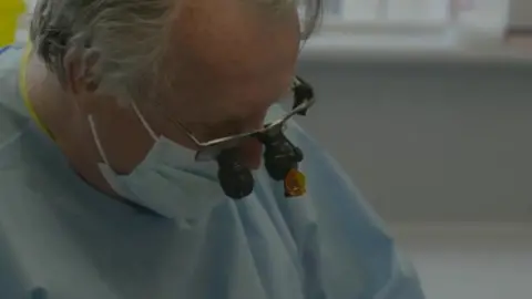 Dentist performing a procedure