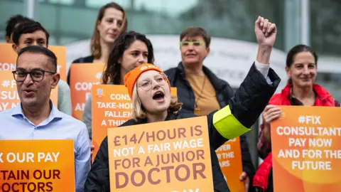 Getty Images Junior doctors and consultants picket outside University College Hospital in London