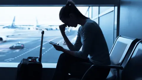 kieferpix woman at airport