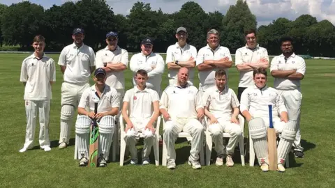 England and Wales Transplant Cricket A team of cricketers in whites, lined up facing the camera