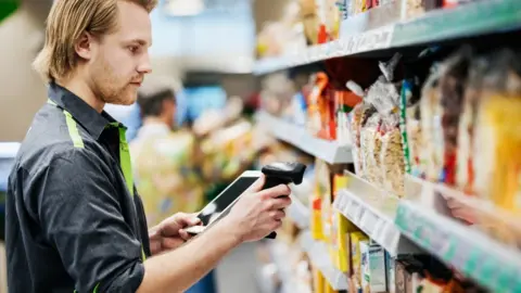 Getty Images Supermarket worker