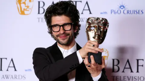 Getty Images Ben Whishaw with the award for Leading Actor during the 2023 BAFTA Television Awards with P&O Cruises at The Royal Festival Hall on May 14, 2023 in London, England