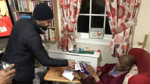 Farhad Ahmad Ahmadiyya Muslim Youth Association visiting people in a care home