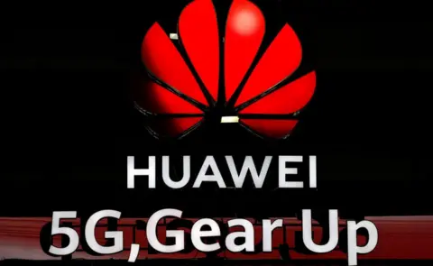 Getty Images Illuminated Huawei and 5G signs are on display during the 10th Global mobile broadband forum hosted by Chinese tech giant Huawei in Zurich on October 15, 2019.