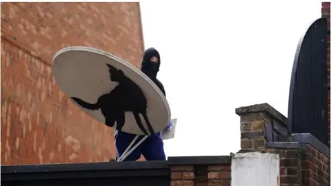 PA Banksy wolf artwork being taken