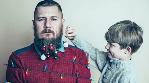 Getty Images Man as Christmas tree