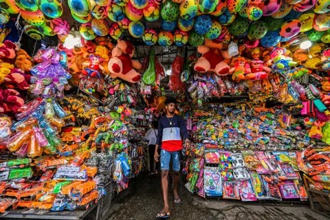 Ishara S. Kodikara / AFP A man waits for customers at a toy shop in Colombo, Sri Lanka, on 20 September 2022