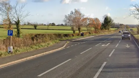 Google Main road with filter lane to small layby