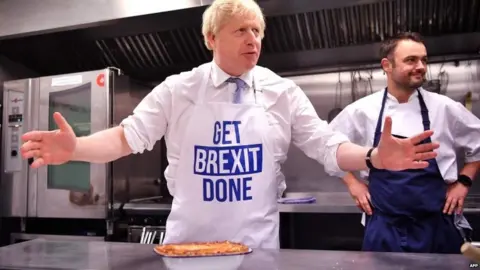 AFP Boris Johnson at a bakery in Derby