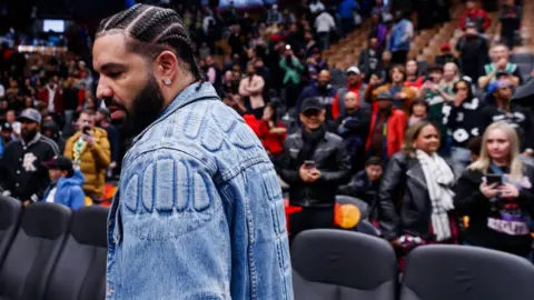 Getty Images File image of Drake at an NBA game