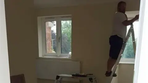 KEITH LAWSON A volunteer working to finish the house