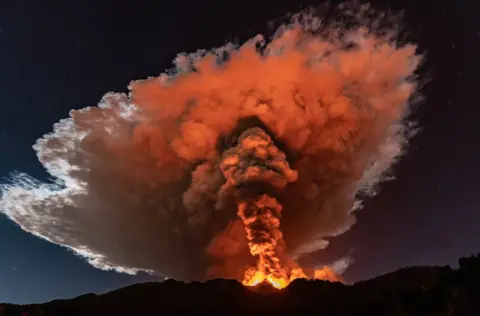 Getty Images Etna has sent up magnificent plumes of orange smoke