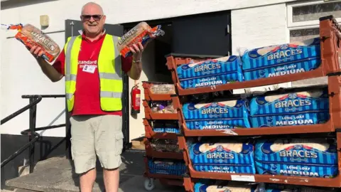 Cymru Creations David Jones holding loaves of bread