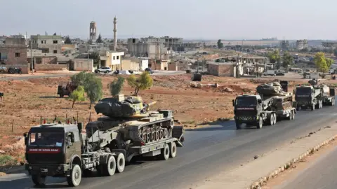 AFP/Getty A Turkish convoy in Idlib reportedly heading for the rebel-held town of Khan Sheikhoun