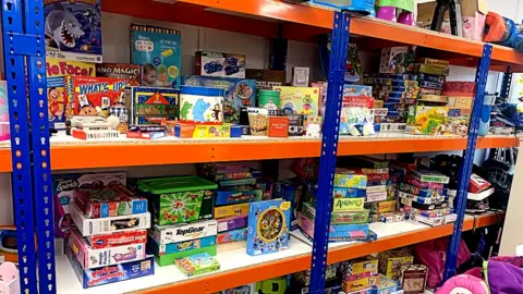 Shelves full of toys and games