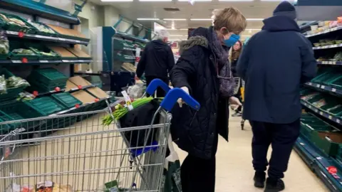 Reuters shopper wearing face mask