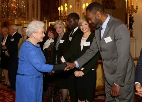 Getty Images Queen Elizabeth II meets guests, including Lenny Henry, during the Dramatic Arts reception at Buckingham Palace on February 17, 2014 in London