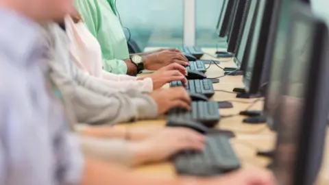 Getty Images People typing at keyboards