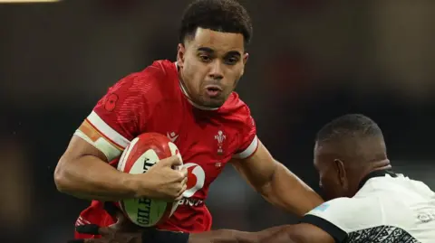 Ben Thomas attacks for Wales against Fiji