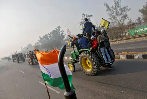 REUTERS / DANISH SIDDIQUI Farmers take part in a tractor rally